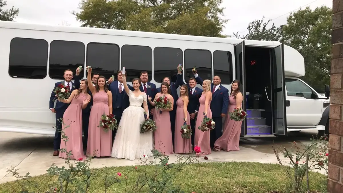 Wedding party in front of our party bus